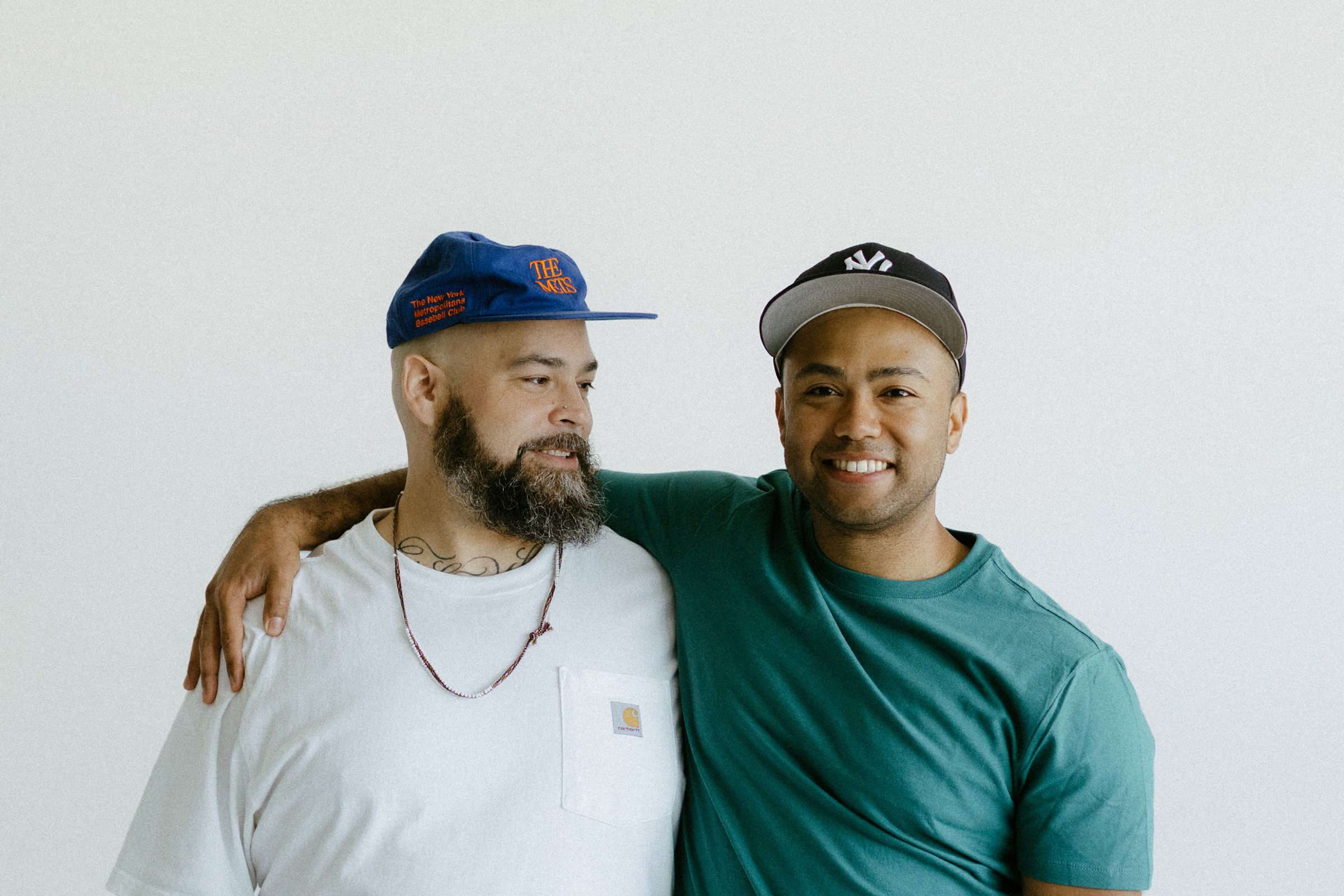 Edrian with a friend, arms around shoulders